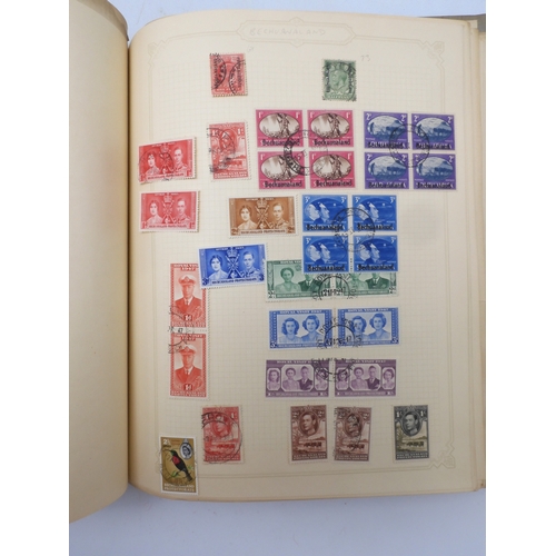 7045 - A worldwide stamp collection in four albums including 1 album of  GB with early phosphor sets, one a...