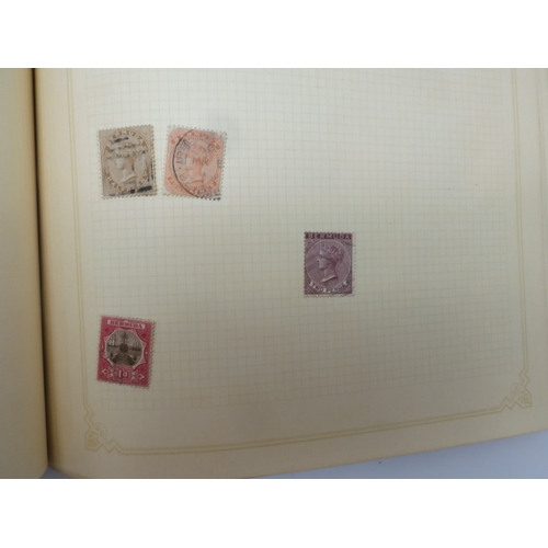 7045 - A worldwide stamp collection in four albums including 1 album of  GB with early phosphor sets, one a...