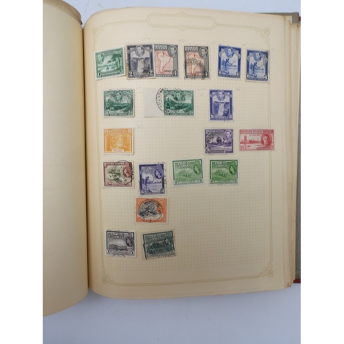 7045 - A worldwide stamp collection in four albums including 1 album of  GB with early phosphor sets, one a... 