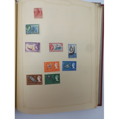 7045 - A worldwide stamp collection in four albums including 1 album of  GB with early phosphor sets, one a...