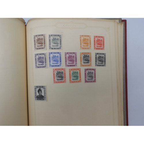 7045 - A worldwide stamp collection in four albums including 1 album of  GB with early phosphor sets, one a...