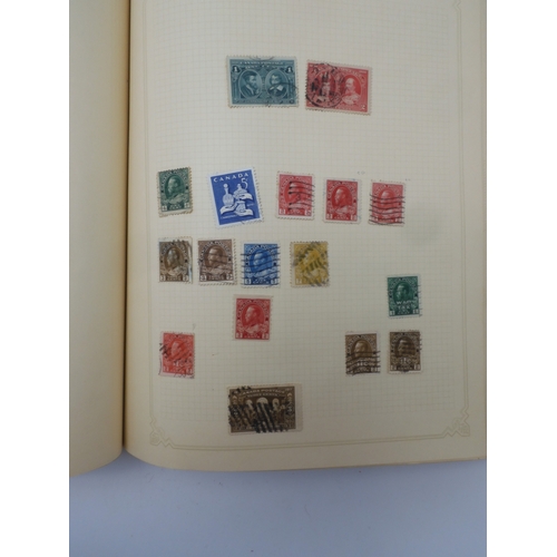 7045 - A worldwide stamp collection in four albums including 1 album of  GB with early phosphor sets, one a...