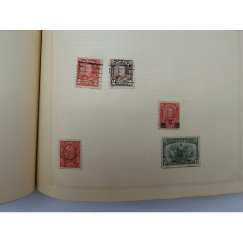 7045 - A worldwide stamp collection in four albums including 1 album of  GB with early phosphor sets, one a...