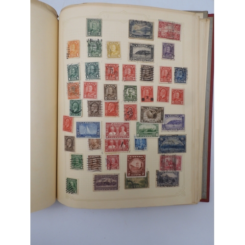 7045 - A worldwide stamp collection in four albums including 1 album of  GB with early phosphor sets, one a... 