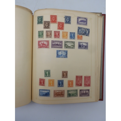 7045 - A worldwide stamp collection in four albums including 1 album of  GB with early phosphor sets, one a... 