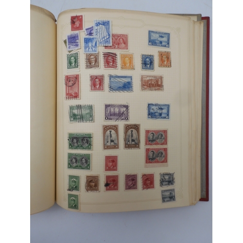 7045 - A worldwide stamp collection in four albums including 1 album of  GB with early phosphor sets, one a... 