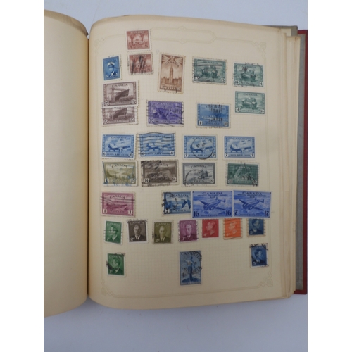 7045 - A worldwide stamp collection in four albums including 1 album of  GB with early phosphor sets, one a... 