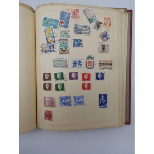 7045 - A worldwide stamp collection in four albums including 1 album of  GB with early phosphor sets, one a... 