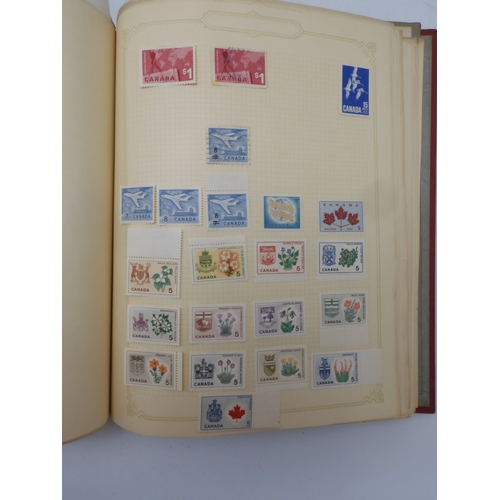 7045 - A worldwide stamp collection in four albums including 1 album of  GB with early phosphor sets, one a... 