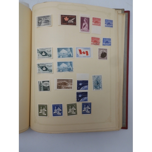 7045 - A worldwide stamp collection in four albums including 1 album of  GB with early phosphor sets, one a...