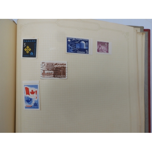 7045 - A worldwide stamp collection in four albums including 1 album of  GB with early phosphor sets, one a... 