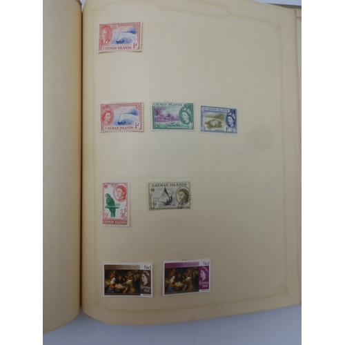 7045 - A worldwide stamp collection in four albums including 1 album of  GB with early phosphor sets, one a...