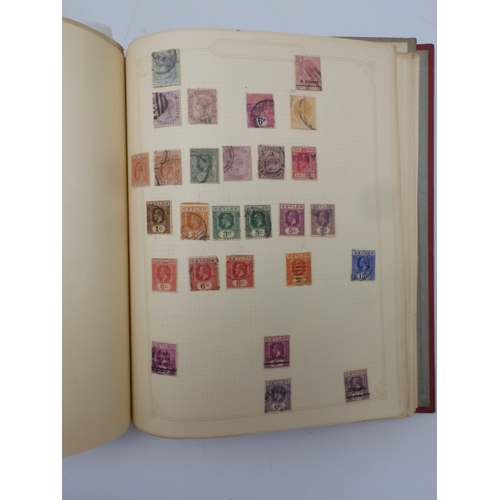 7045 - A worldwide stamp collection in four albums including 1 album of  GB with early phosphor sets, one a... 