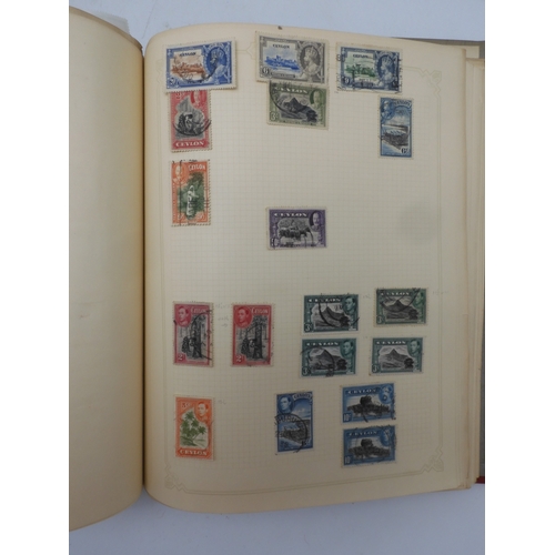 7045 - A worldwide stamp collection in four albums including 1 album of  GB with early phosphor sets, one a...