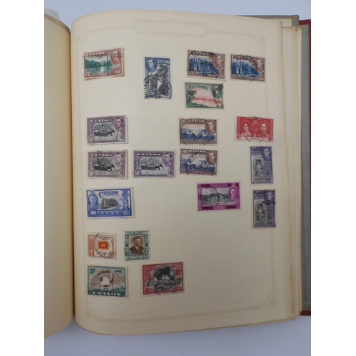 7045 - A worldwide stamp collection in four albums including 1 album of  GB with early phosphor sets, one a... 