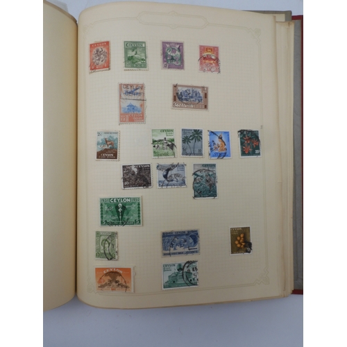 7045 - A worldwide stamp collection in four albums including 1 album of  GB with early phosphor sets, one a...