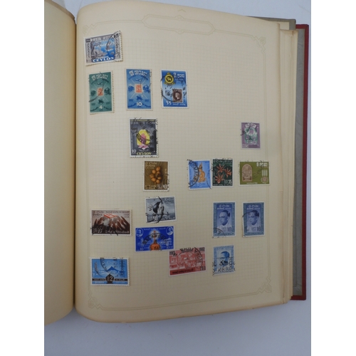 7045 - A worldwide stamp collection in four albums including 1 album of  GB with early phosphor sets, one a... 