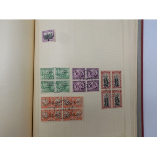 7045 - A worldwide stamp collection in four albums including 1 album of  GB with early phosphor sets, one a...