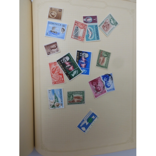 7045 - A worldwide stamp collection in four albums including 1 album of  GB with early phosphor sets, one a...