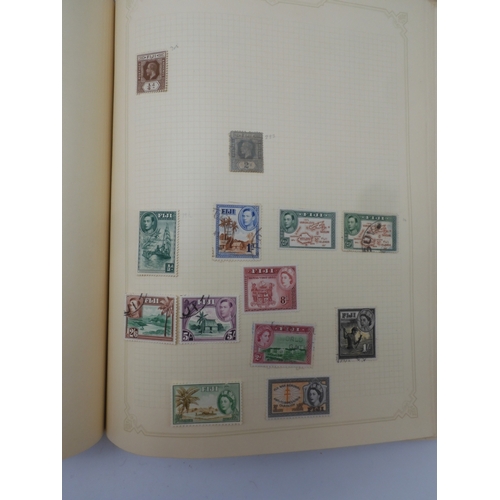 7045 - A worldwide stamp collection in four albums including 1 album of  GB with early phosphor sets, one a... 