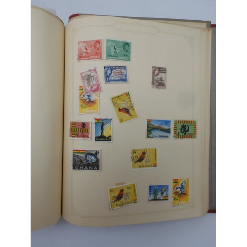 7045 - A worldwide stamp collection in four albums including 1 album of  GB with early phosphor sets, one a...