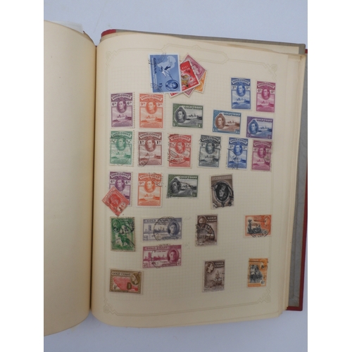 7045 - A worldwide stamp collection in four albums including 1 album of  GB with early phosphor sets, one a...