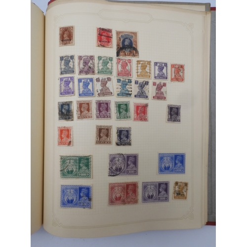 7045 - A worldwide stamp collection in four albums including 1 album of  GB with early phosphor sets, one a...