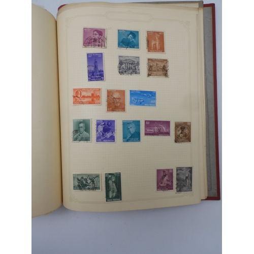 7045 - A worldwide stamp collection in four albums including 1 album of  GB with early phosphor sets, one a... 