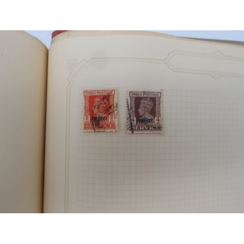 7045 - A worldwide stamp collection in four albums including 1 album of  GB with early phosphor sets, one a...