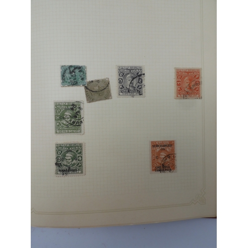 7045 - A worldwide stamp collection in four albums including 1 album of  GB with early phosphor sets, one a... 