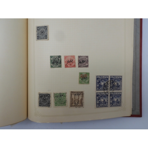 7045 - A worldwide stamp collection in four albums including 1 album of  GB with early phosphor sets, one a... 