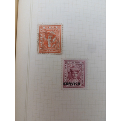 7045 - A worldwide stamp collection in four albums including 1 album of  GB with early phosphor sets, one a...