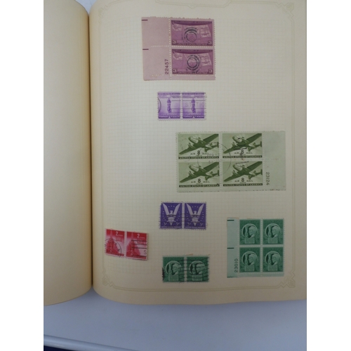 7045 - A worldwide stamp collection in four albums including 1 album of  GB with early phosphor sets, one a...