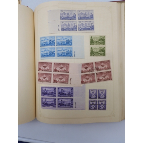 7045 - A worldwide stamp collection in four albums including 1 album of  GB with early phosphor sets, one a... 