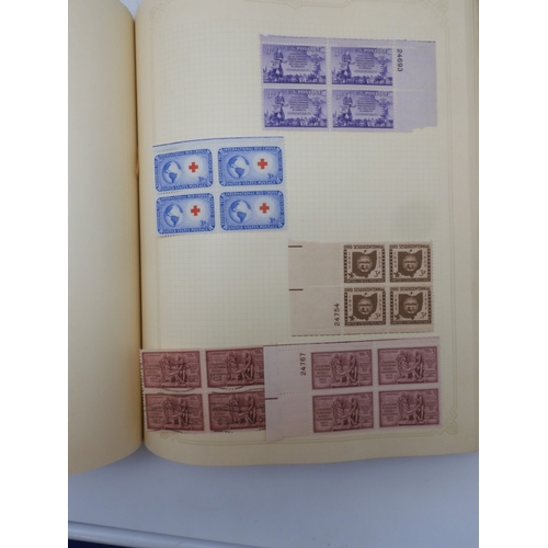 7045 - A worldwide stamp collection in four albums including 1 album of  GB with early phosphor sets, one a... 