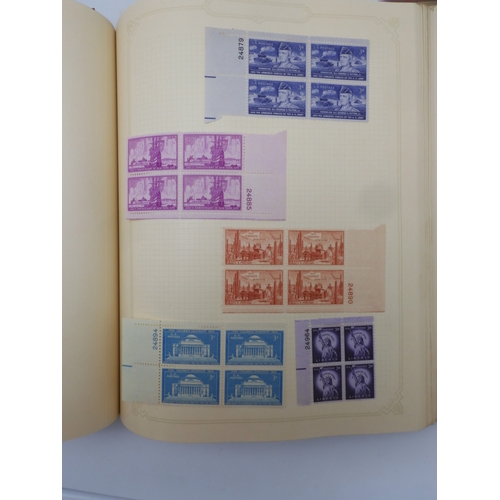 7045 - A worldwide stamp collection in four albums including 1 album of  GB with early phosphor sets, one a...