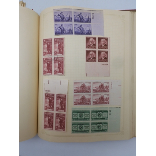 7045 - A worldwide stamp collection in four albums including 1 album of  GB with early phosphor sets, one a...