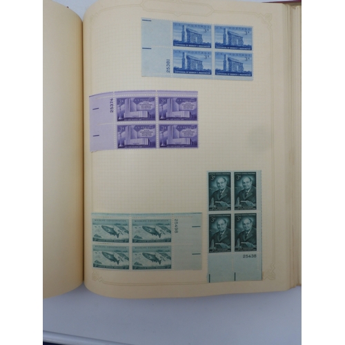 7045 - A worldwide stamp collection in four albums including 1 album of  GB with early phosphor sets, one a... 