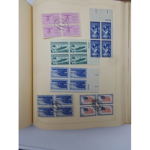 7045 - A worldwide stamp collection in four albums including 1 album of  GB with early phosphor sets, one a...