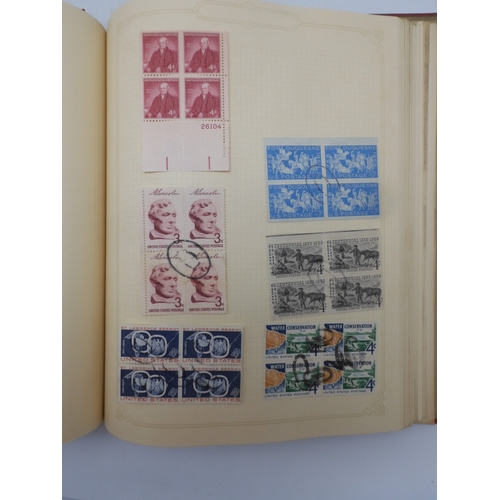 7045 - A worldwide stamp collection in four albums including 1 album of  GB with early phosphor sets, one a... 