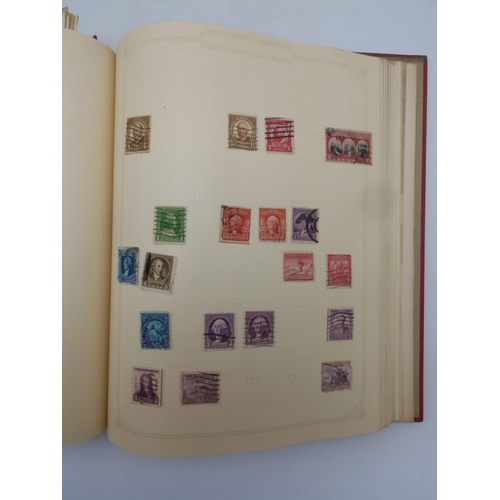 7045 - A worldwide stamp collection in four albums including 1 album of  GB with early phosphor sets, one a... 