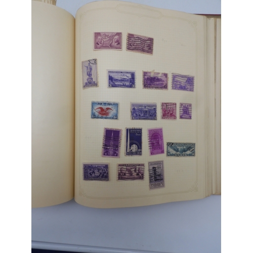 7045 - A worldwide stamp collection in four albums including 1 album of  GB with early phosphor sets, one a...