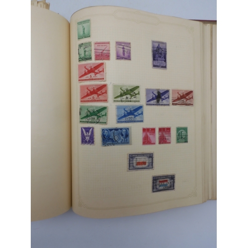 7045 - A worldwide stamp collection in four albums including 1 album of  GB with early phosphor sets, one a...