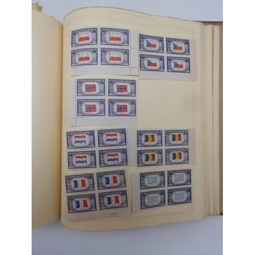 7045 - A worldwide stamp collection in four albums including 1 album of  GB with early phosphor sets, one a... 