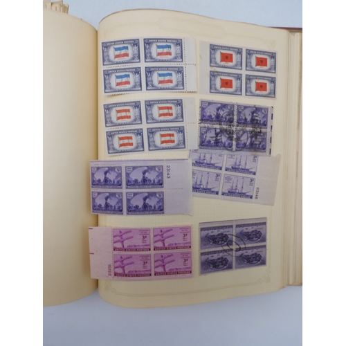 7045 - A worldwide stamp collection in four albums including 1 album of  GB with early phosphor sets, one a...