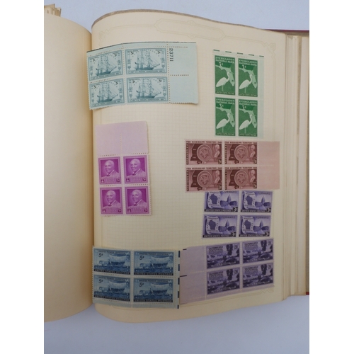 7045 - A worldwide stamp collection in four albums including 1 album of  GB with early phosphor sets, one a...