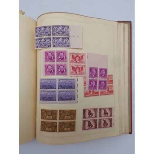 7045 - A worldwide stamp collection in four albums including 1 album of  GB with early phosphor sets, one a...