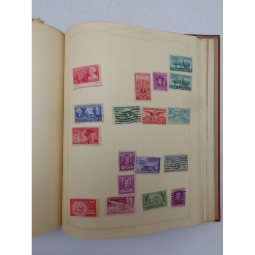 7045 - A worldwide stamp collection in four albums including 1 album of  GB with early phosphor sets, one a...