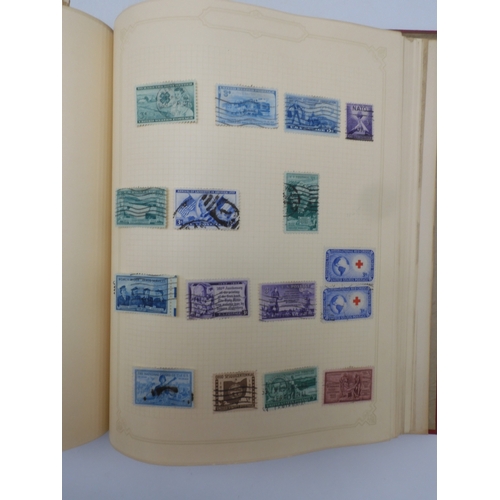 7045 - A worldwide stamp collection in four albums including 1 album of  GB with early phosphor sets, one a...