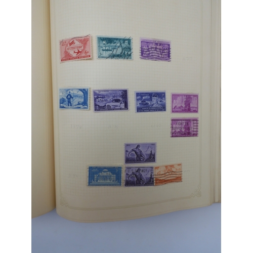 7045 - A worldwide stamp collection in four albums including 1 album of  GB with early phosphor sets, one a... 